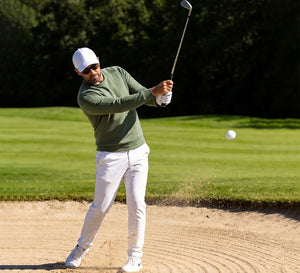 Model Playing Golf in the MAELREG Crewneck Sweatshirt with Zip Pockets