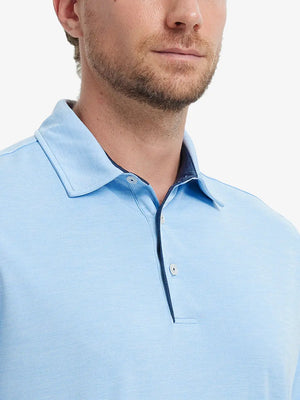 Close-up of Modern Fit Melange Polo front (nose to chest) in LIGHT BLUE HEATHER, showing soft melange texture.