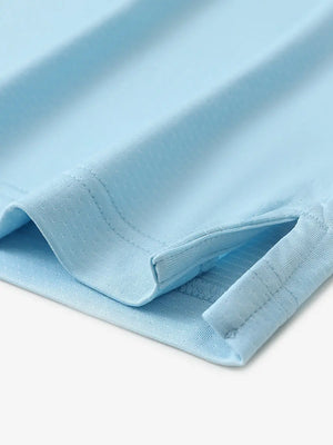 Detail of side slit hem on LIGHT BLUE 4 Way Stretch Jacquard Polo — clean stitching and stretch finish