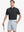 Model in BLACK Jacquard Polo posing with golf club — active and athletic on the front view