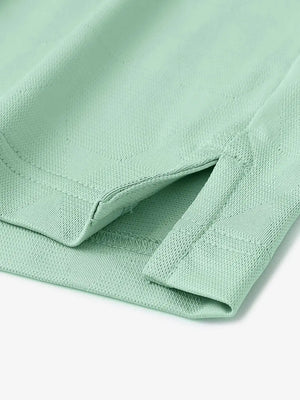 Close-up detail of hem opening on Modern Texture Stylish Polo in BERYL GREEN.