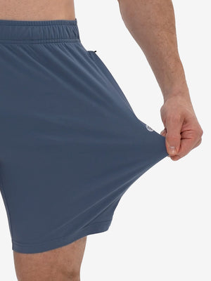 View showing loose fit of misty blue breathable running shorts with 4 zipper pockets