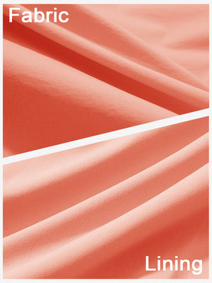 Close-up texture of peach pink women's stretch a-line golf skort with 7 pockets fabric showing detailed outer and inner lining material.