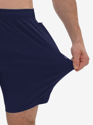 View showing loose fit of navy breathable running shorts with 4 zipper pockets