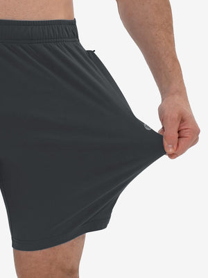 View showing loose fit of dark grey breathable running shorts with 4 zipper pockets