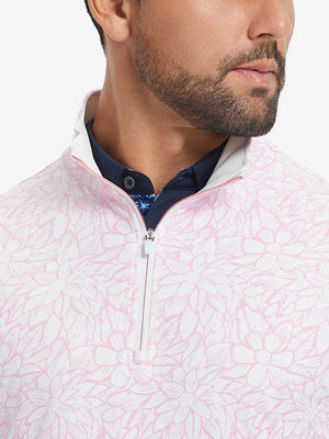 Close-up from nose to chest, showing zipper collar detail and fabric pattern of the pink artichoke pullover.