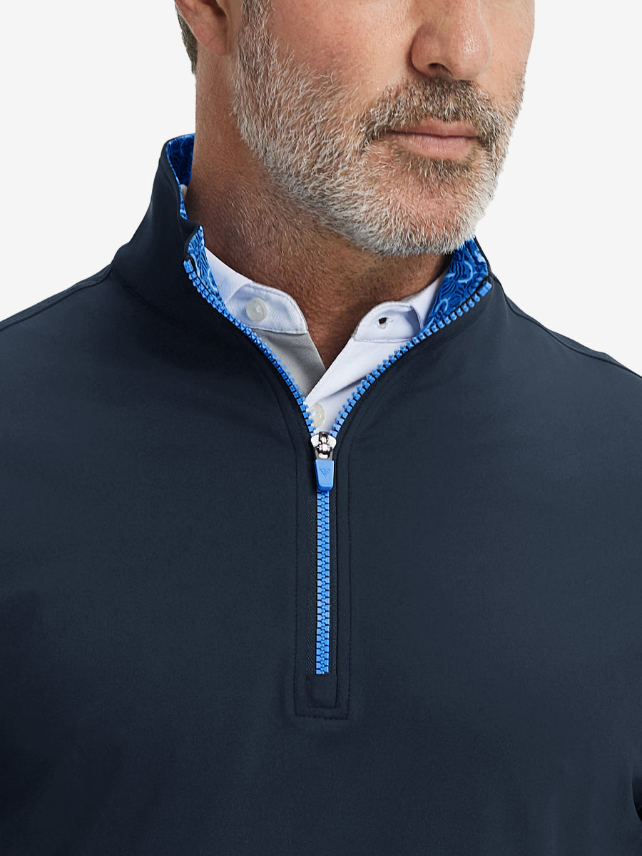 Close-up from nose to chest, showing collar and zipper detail of the navy golf pullover.