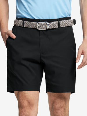 Front waist to knee view of black water resistant golf 7 inch shorts, clean athletic fit.