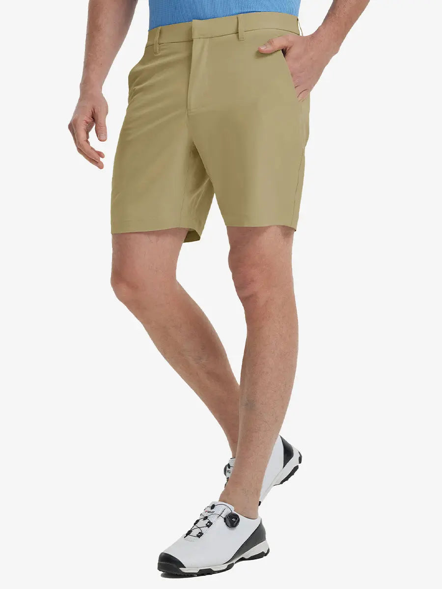 Front view of model’s lower body with hands in pockets, wearing Player Fit Versatile Solid Shorts 7 Inch – KHAKI