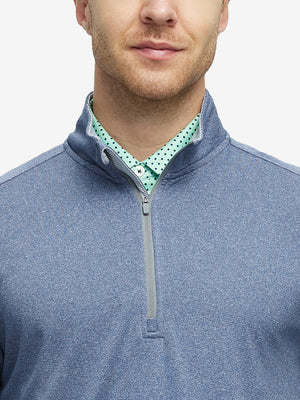 Front view from nose to chest of model wearing saxony blue melange moisture wicking quarter zip pullover