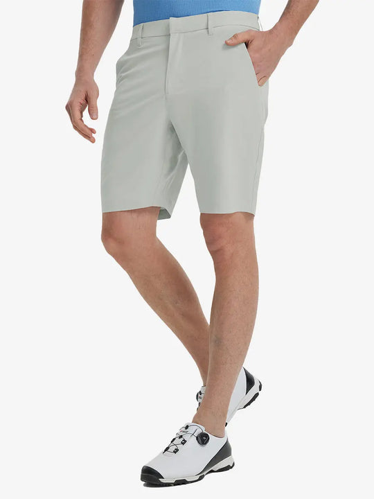 Front view of model’s lower body with hands in pockets, wearing Player Fit Versatile Solid Shorts 9 Inch – GLACIER GREY