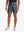 DARK GREY 4-way Stretch Performance Solid Shorts, golfer front lower body with club, 7 Inch view