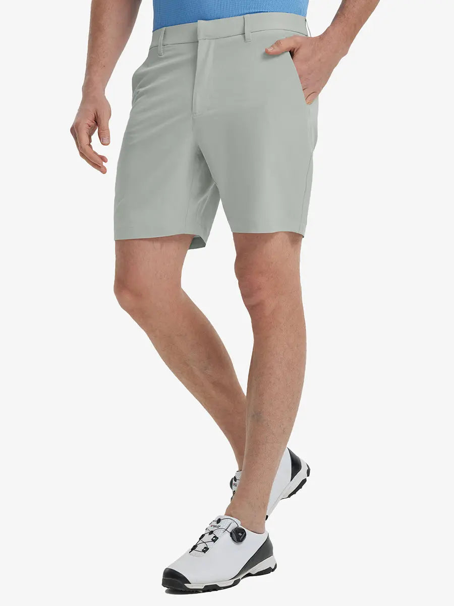 Front view of model’s lower body with hands in pockets, wearing Player Fit Versatile Solid Shorts 7 Inch – NEUTRAL GREY