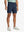 NAVY 4-way Stretch Performance Solid Shorts, golfer front lower body with club, 7 Inch view