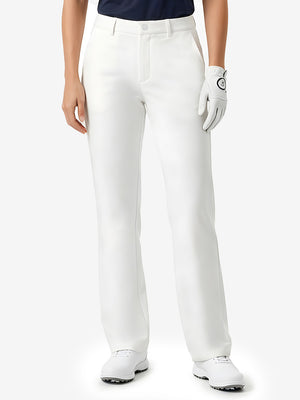 Front lower body shot of model wearing white women's regular fit stretchy golf pants