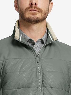 Close-up from nose to chest, showing collar detail and fleece texture of the Agave Green winter jacket.