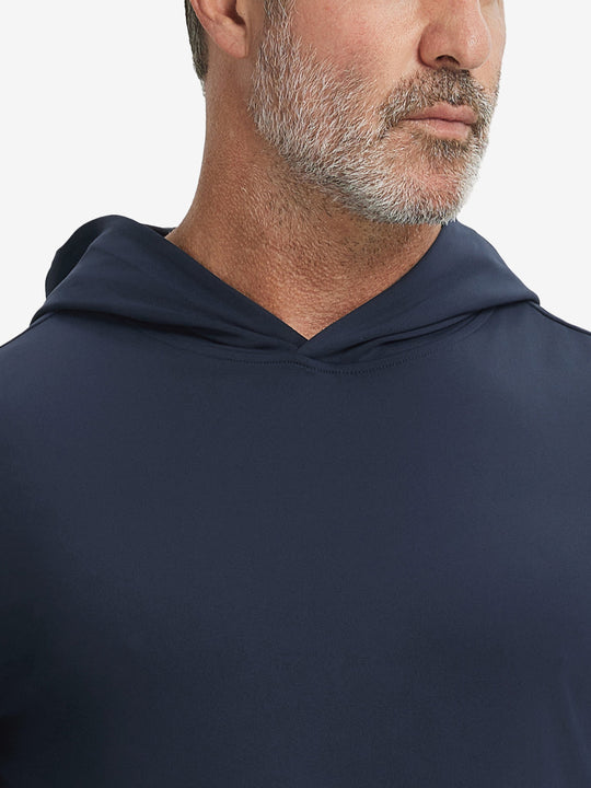 Close-up from nose to chest, showing soft collar texture and stitching detail of the navy hoodie.