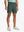 OLIVE GREEN 4-way Stretch Performance Solid Shorts, golfer front lower body with club, 7 Inch view