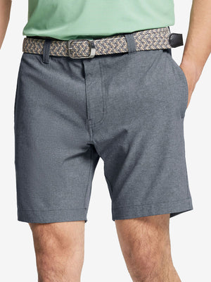 Front view of youth wearing navy Heather Performance Golf Shorts, showing fit and style