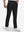 Front lower body shot of model wearing black breathable casual slacks with 4 pockets