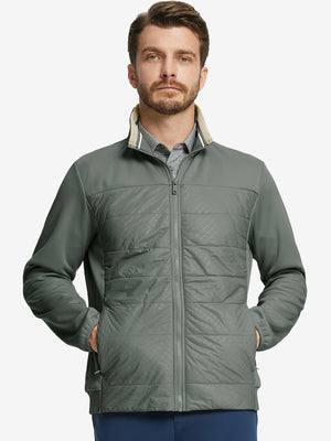 Front view of model with both hands in side pockets, wearing Golf Fleece Winter Jacket in Agave Green.
