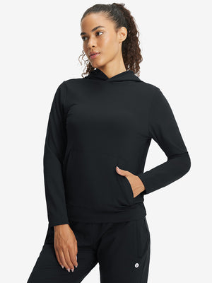 Model with one hand in side pocket wearing women's lightweight hoodies pullover in black.