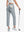 Back lower-body view holding a golf ball with glove in rear pocket wearing LIGHT GREY Women's 7/8 Ankle Golf Track Pants.