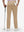 Back lower body shot of model wearing light khaki breathable casual slacks with 4 pockets
