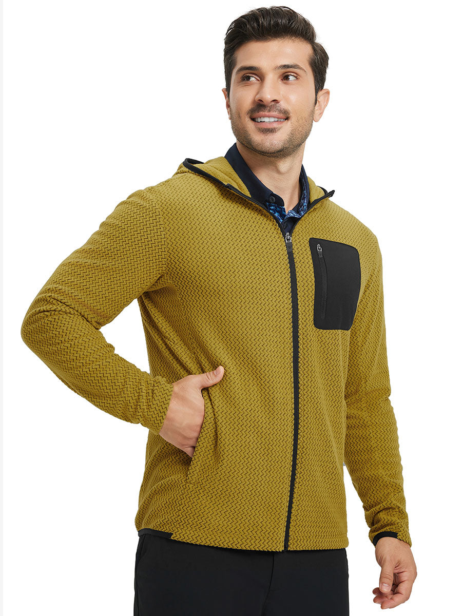 Model with one hand in pocket wearing full zip fleece hoodied jacket in yellow, relaxed look.