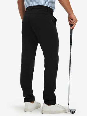 Back lower-body view of lightweight moisture wicking dress pants, model with golf club in black.