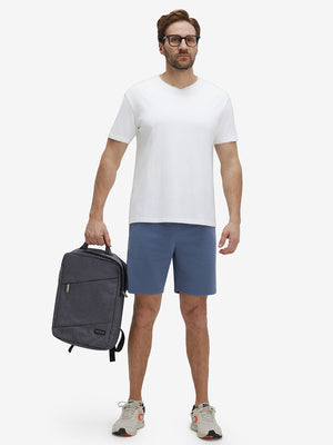 Front full body shot of model exercising in misty blue breathable running shorts with 4 zipper pockets