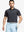 Model in Black Stripe Pinstripe Jersey Performance Polo holding golf club, front half-body view								
