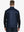 Half-body front view of model holding golf club wearing NAVY GEO Stretch Solid Fleece Quarter-Zip Vest.								
