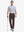 Full-body front shot with golf club, styled in Stretch Plain Everyday Pants – DARK BROWN