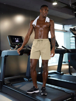 Full-body gym view of model in KHAKI 2 in 1 Running Sports Shorts with Liner.