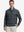 Front upper body view of model standing in grey houndstooth full print quarter zip pullover, relaxed look.
