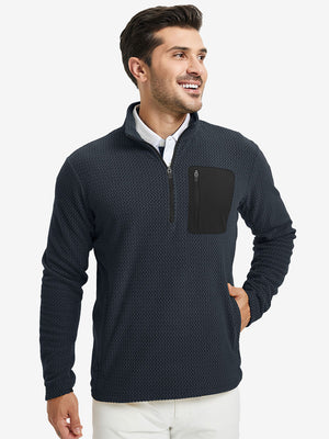 Model with one hand in side pocket, wearing midweight warm stretchy quarter zip pullover in navy.