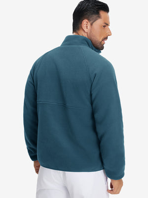 Back view of the model in the reversible fleece jacket with 5 pockets in dark blue.