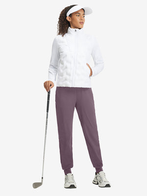 Full-body front view of model wearing women's stretch fleece lined water resistant joggers in light pinkish purple.