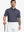 Half-body front view of model holding golf club wearing SPACE DYE STRIPE Performance Yarn Dye Striped Polo