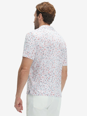 Back half-body view of model wearing the white polka dots 4 way stretch print collared polo shirt, highlighting the rear silhouette