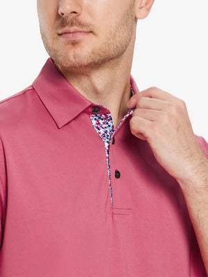 Male model wearing the Cranberry Everyday Classic Solid Polo, front view from nose to chest