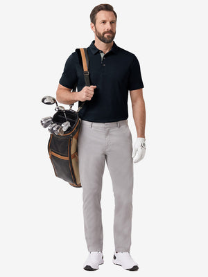 Front full body shot of model exercising in navy  ultra-comfort slim fit roma knit polo shirts