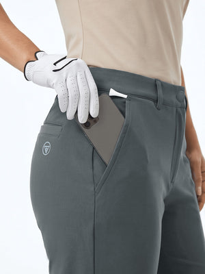 Detail view of front pocket on dark gray women's regular fit stretchy golf pants