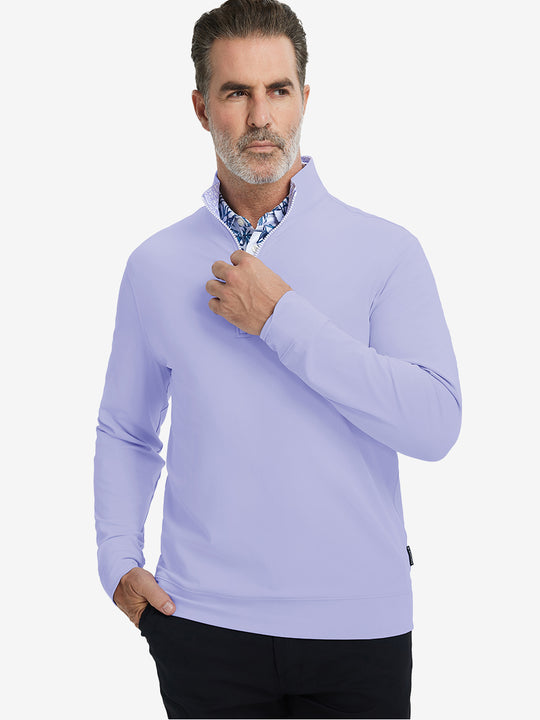 Front upper body view of model wearing lightweight golf quarter zip pullover in lavender, relaxed fit.