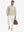 Full-body shot of the model wearing the reversible fleece jacket with 5 pockets in khaki.