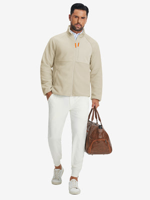 Full-body shot of the model wearing the reversible fleece jacket with 5 pockets in khaki.