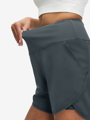 Pantalones cortos de secado rápido 2 en 1 de talle alto para mujer con 7 bolsillos