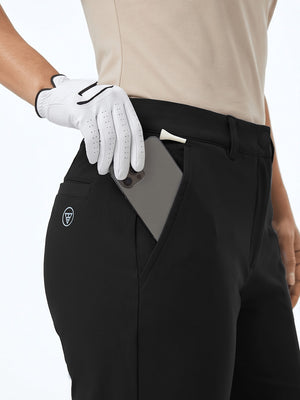 Detail view of front pocket on black women's regular fit stretchy golf pants