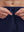 Detail view of elastic waistband on navy breathable running shorts with 4 zipper pockets